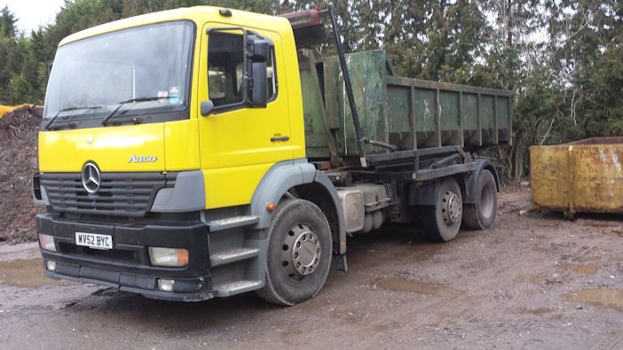 A roll-on roll-off skip on the hook loader